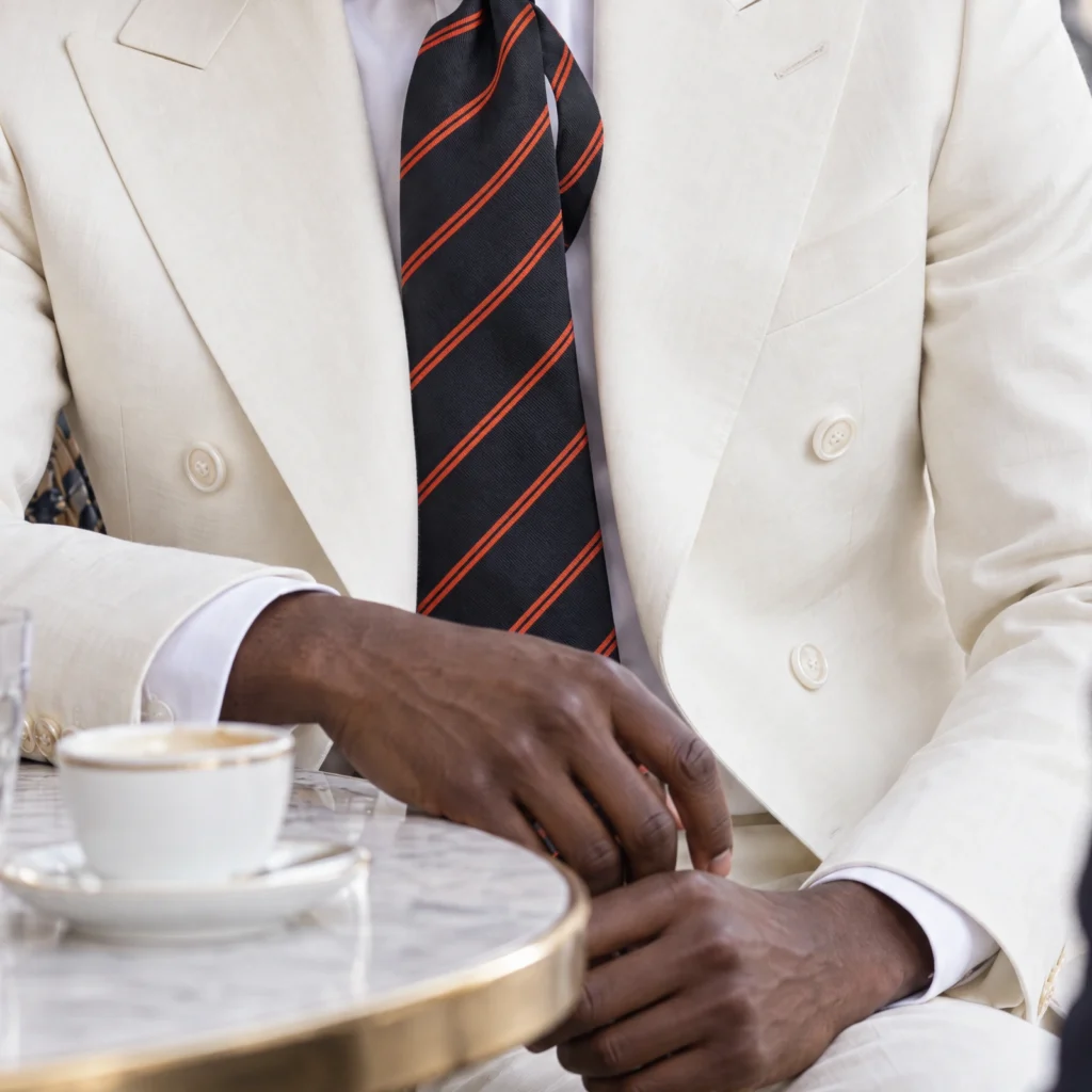 Blue striped woven silk tie, cropped detail of the pattern and fabric in the styling image.
